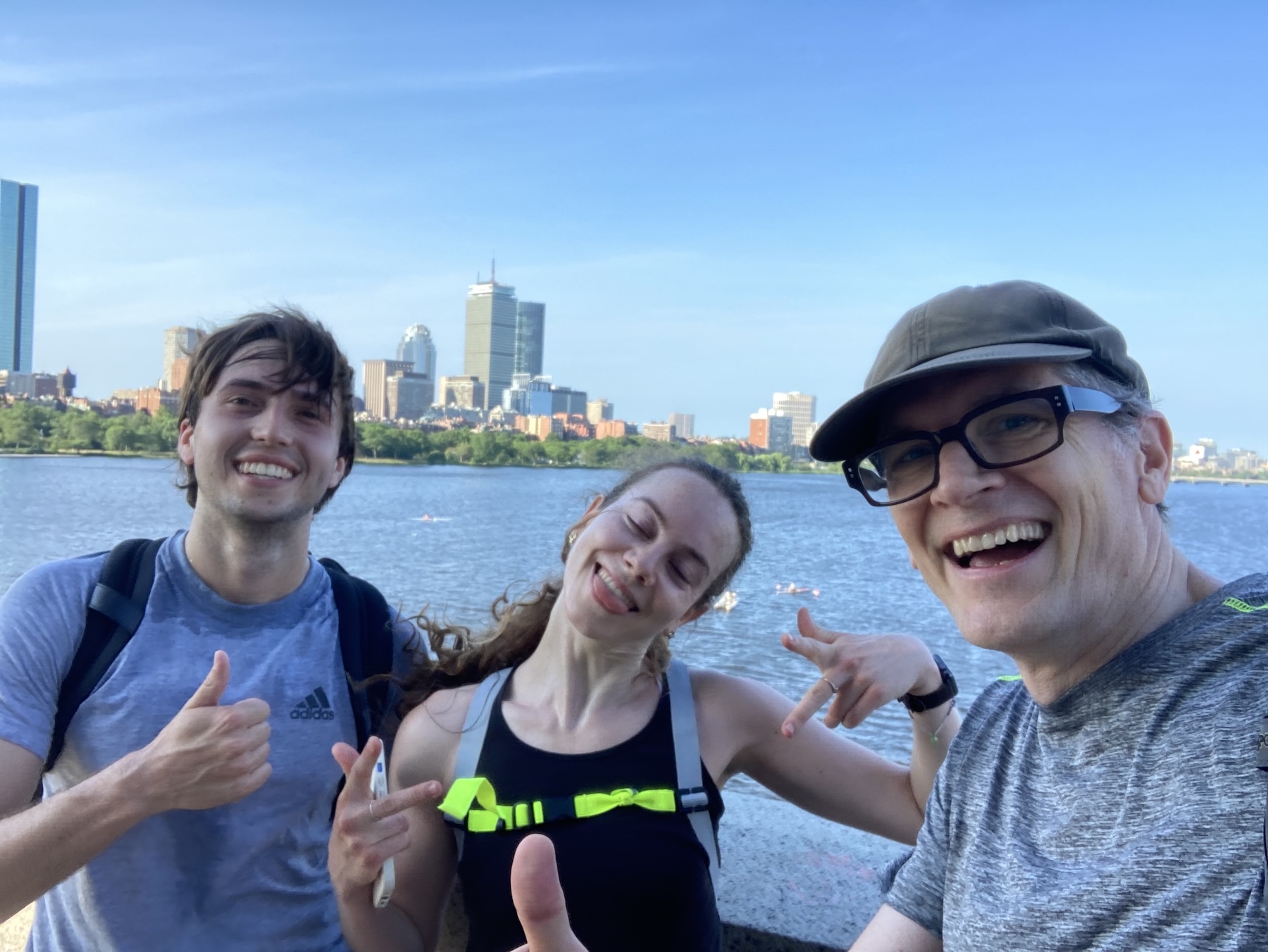 Chase, Libby, and Mark stopping on their run to pose for a photo on the bridge