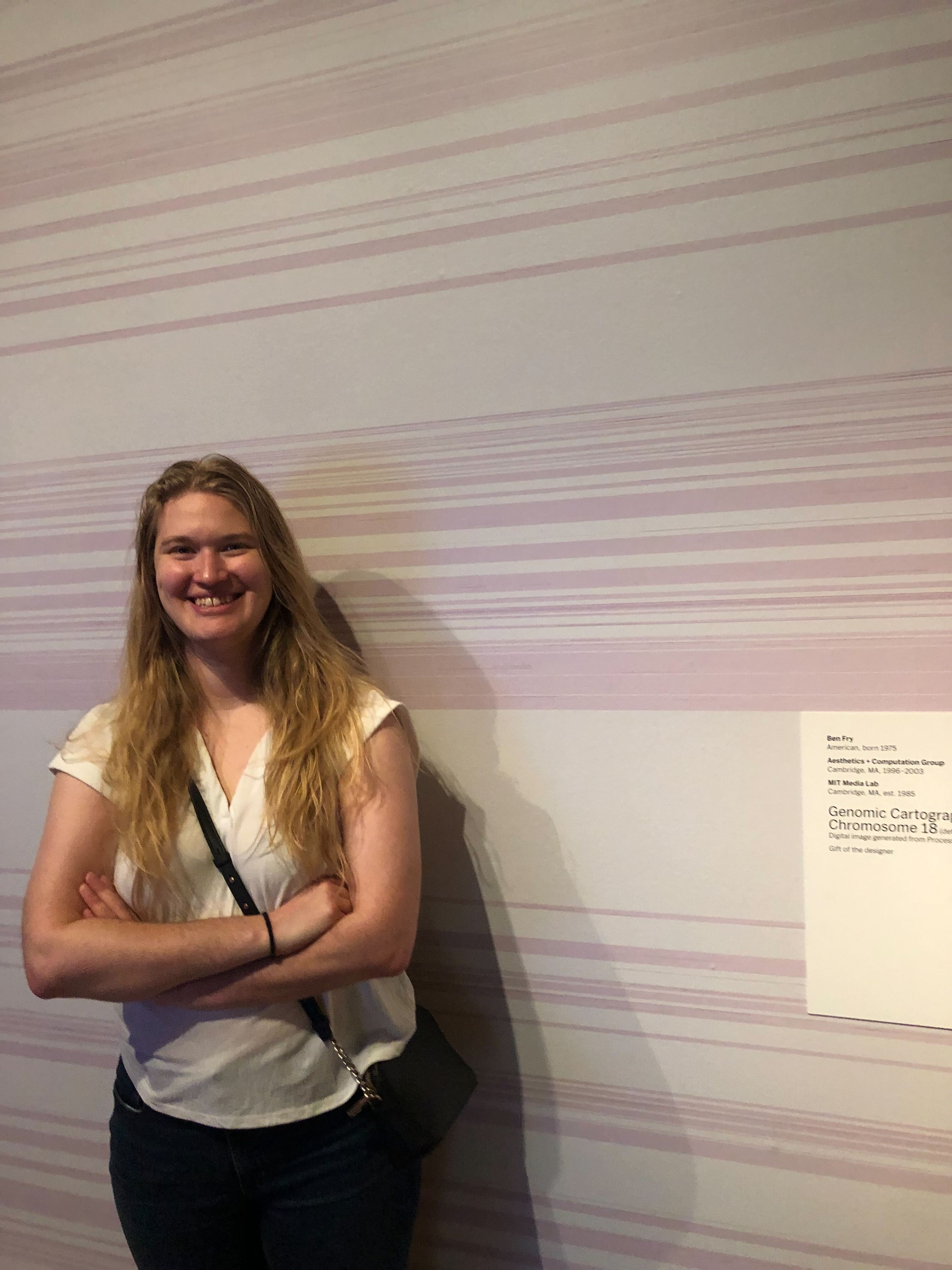 Ellory in front of the exhibit wall